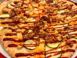 Star Veggie with mozzarella, tomato, jackfruit, zucchini, tofu, pineapple & bbq sauce  at Pizzeria Sa Cova in Mallorca