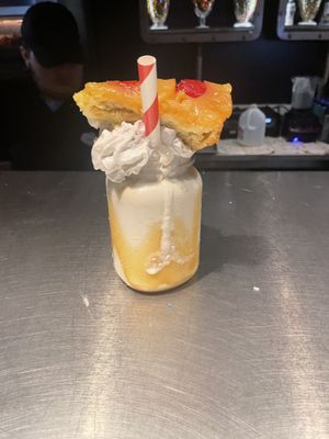 The only vegan milkshake currently pineapple upside down shake 18$ share, sugar  at Universal Studios - The Toothsome Chocolate Emporium & Savory Feast Kitchen in Orlando
