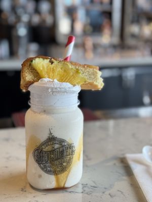 Right Side Up pineapple vegan milkshake  at Universal Studios - The Toothsome Chocolate Emporium & Savory Feast Kitchen in Orlando