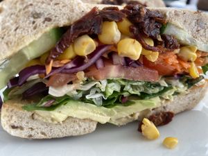 A vegan bagel with veggies, avocado and hummus  at The Green Corner in Koege