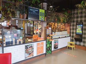 The Fresh Factory indoor with one of the two  order and pay touch screens. You also see the screen with your number when it is prepared and when it is ready. at The Fresh Factory in Nijmegen