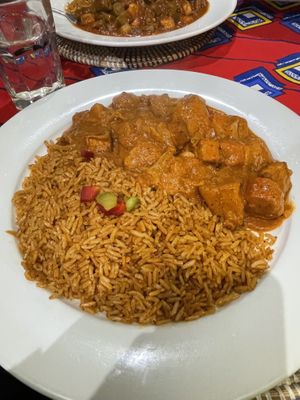 Mafe tofu with joloff rice and okra tofu with joloff rice in the background  at Joloff in Brooklyn