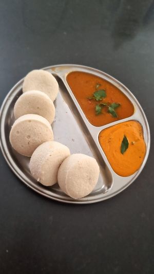 Idly 
Idly is a soft, Pillowy steamed savory cake made from fermented rice & lentil batter served with sambar & Chutney
Vegan/ Gluten free/ Dairy free  at Udupi Flavours In Australia in Rockbank