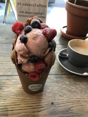 Vegan cinnamon waffle with strawberry gelato, berries and maple syrup  at Little Shop of Waffles in Manly