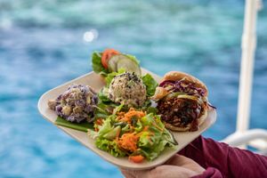 LUNCH - BBQ jackfruit sandwich, chickpea salad sandwich, 'ulu & sweet potato salad, and a green salad with pineapple dressing for lunch. Indulge after with a chocolate chip cookie. at Fair Wind in Kailua Kona