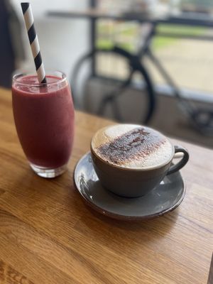Smoothie and oat milk coffee  at The Hub and Spoke Cafe in Dunstable