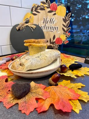 Vegan squash pasty and vegan pumpkin seed cinnamon bun at The Hub and Spoke Cafe in Dunstable