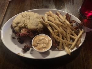 Not a good picture but SO good! Jackfruit Rueben Sandwich with GF/Vegan bun, sweet potato and shoestring fries, vegan southwest sauce    at Lucky's Taproom and Eatery in Dayton