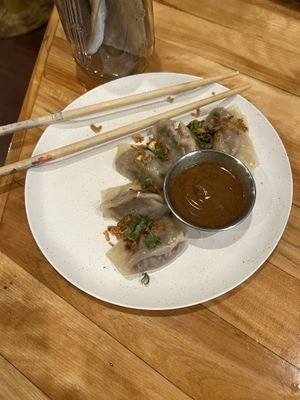 Red curry dumplings with peanut sauce 10/10  at Le Salon Enchanthé in Montreal