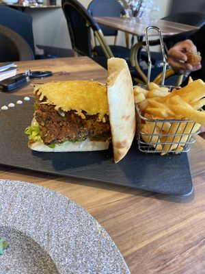 Burger with side of chips  at Chef N Fire in Helensvale