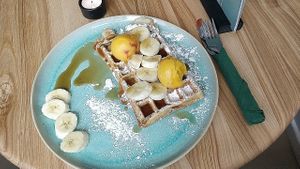Warm waffle with fruit, maple syrup & Luicella's ice cream at Good One Café in Hamburg