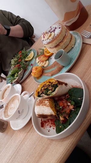 breakfast burrito, pancakes with fruit & ice cream, avocadobread at Good One Café in Hamburg