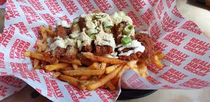 Garlic parmesan fries with homemade fried chicken at Really Happy Chicken at Vaulty Towers in South East London