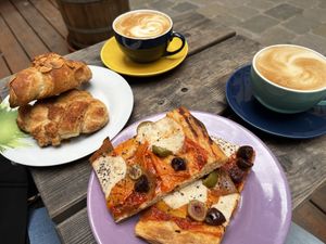 Nougat and marzipan croissant and pizza with mozzarella, olives, ham and peppers  at Schwarzbrot OG in Vienna