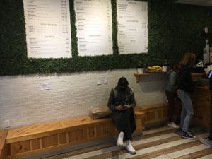 Benches to sit (there are no tables or chairs; this place is primarily for takeout). at Juicy Cube in New York City
