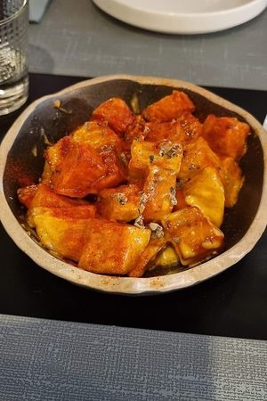 Creamy patatas bravas with homemade smoked chipotle sauce at Copenhagen in Valencia