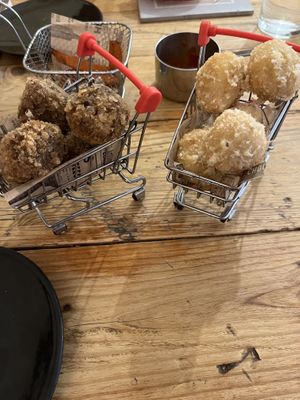 Vegan beef croquettes on the left, and vegan cheese on the right   at Atabalats in Barcelona
