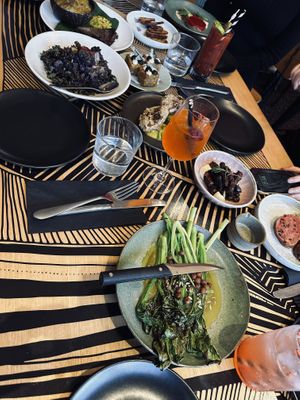 Grilled brassicas, cauliflower salad, sop sop with injera, cassava & thyme rostis, mushroom parfait, artichokes, tamarind and island damper   at Big Esso in Melbourne