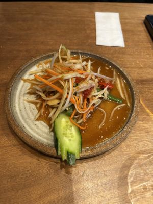 Papaya salad which I already started to eat   at Chompoo in Tokyo