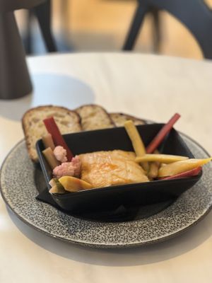 Baked Raclette
Toasted sourdough bread, house pickle, and shichimi oil  at Adesse in London