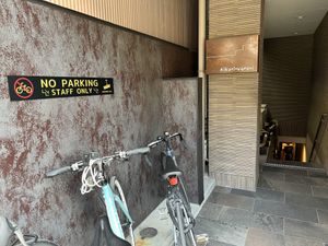 Entrance is down these stairs. The door is at the end of the hallway    at Vegginy in Kyoto