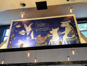 Gorgeous mural way up high at Bar Vegan in Albany