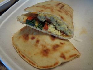 Vegan Morning Panini. Tofu eggs, sautéed spinach, roasted red peppers, roasted broccoli, plant mozzarella. Missing the plant mozz, though, a kitchen mistake and upsetting. at Evexia in Aurora