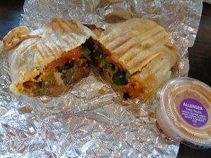 Southwest Breakfast Burrito. Tofu scramble, plant cheddar, roasted tomato, fresh jalapenos, roasted home fries, black bean and corn salsa in a tortilla with a side of spicy cashew ranch. Generous portion and medley of flavors. Might be a new fave!!!
 at Evexia in Aurora