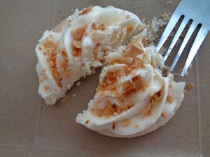 Gourmet Sugar Cookie (GF/V)- sugar cookie with toasted coconut, half-eaten. Yum! at Evexia in Aurora