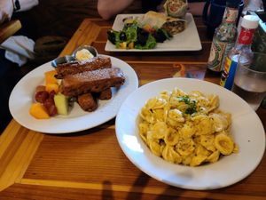I had buffalo Mac'n Cheese and French Toast Sticks, and my friend had a breakfast burrito. Everything was so delicious! at Beach'n SF in San Francisco