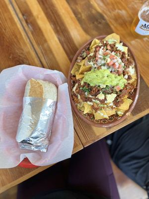 Asada burrito & Al pastor nachos 👌🏼   at Mis Tacones in Portland