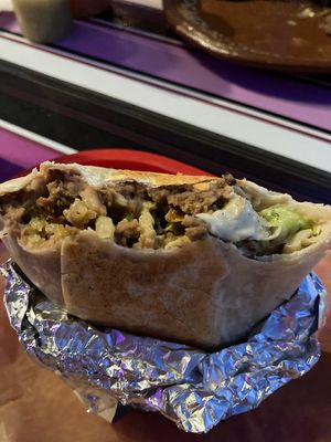 carne asada burrito with guac added at Mis Tacones in Portland
