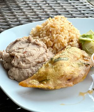 Soyrizo Empanada side of beans & rice  at Mis Tacones in Portland