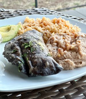 Elote empanada with side of beans & rice  at Mis Tacones in Portland