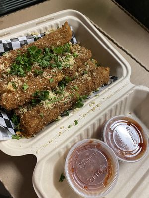Mozzarella sticks with marinara to dip at Secret Vegan Pizza in Los Angeles