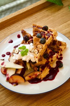 We have breakfasts as well! 
You can have waffles, tofu scramble or oatmeal :) at Dosa Dosa in Prague