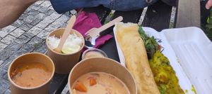 Bad picture, I know. But shows red Thai curry with rice and dosa menu with potatoes and chutney. at Dosa Dosa in Prague