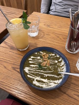 Spinach soup with house made lemonade   at Dosa Dosa in Prague
