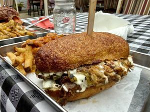 Cheesesteak and animal fries (grilled onions & thousand island)  at Eris Food Co in Oceanside