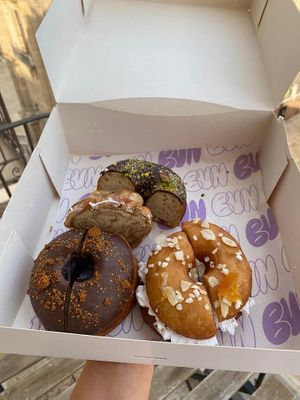 Choc + pistachio, Cardamom Bun, Choc + cherry, Cream + candied orange. at Bun and Coffee in Malaga