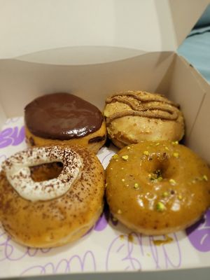 Four big ol' doughnuts at Bun and Coffee in Malaga
