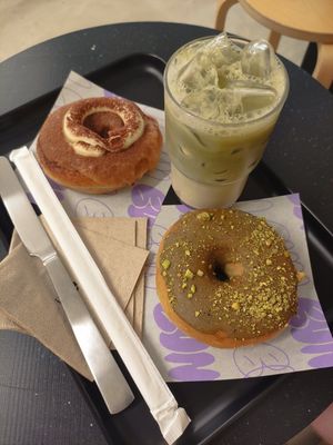 Pistachio and tiramisu doughnuts and iced matcha latte at Bun and Coffee in Malaga