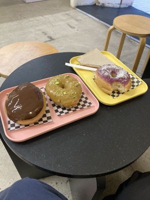 Boston cream, pistachio and raspberry flavour donuts 🍩   at Bun and Coffee in Malaga