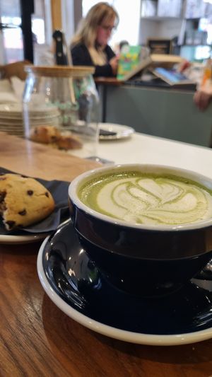 Matcha latte with oat Milk and delicious vegan cookie at Café Bretelles in Strasbourg