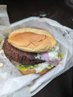 Vegan Crab cake sandwich with NuVegan sauce lettuce tomato and a Very soft bun at NuVegan in Baltimore