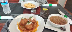 Yuca fries, Mac N' Cheese balls, Lentil soup at Vegan Tierra in Cooper City