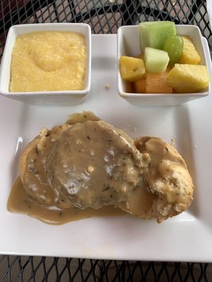Sausage Biscuits and Gravy with Grits and Fruit  at Good Life Cafe in Columbia