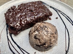 Brownie with ice cream  at Parada Vegana in Cusco
