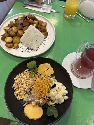 Ceviche and potato/meat plate   at Parada Vegana in Cusco