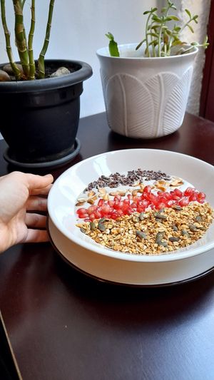 Vegan Smoothie Bowl - Coconut milk + banana + cashew cream + pomegranade + granola + roasted cashews + cocoa nibs at Comércio Café Coworking in Porto